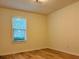 Bedroom with hardwood floors and a window at 225 Magnolia Tree Ct, Johns Creek, GA 30022