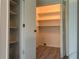 Large closet with adjustable shelving in a bright hallway at 225 Magnolia Tree Ct, Johns Creek, GA 30022