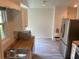 Kitchen featuring stainless steel appliances, light wood counters, and light-colored cabinetry and flooring at 225 Magnolia Tree Ct, Johns Creek, GA 30022