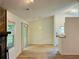Bright living room with hardwood floors and sliding glass doors to the backyard at 225 Magnolia Tree Ct, Johns Creek, GA 30022