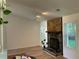 A cozy living room features a stone fireplace and hardwood floors at 225 Magnolia Tree Ct, Johns Creek, GA 30022