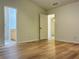Main bedroom with hardwood floors and bathroom entrance at 225 Magnolia Tree Ct, Johns Creek, GA 30022