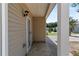 View of the covered back porch, backyard and trees at 3223 Tallon Sw Ln, Atlanta, GA 30311