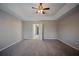Carpeted bedroom with an open door leading to an adjoining room at 3223 Tallon Sw Ln, Atlanta, GA 30311