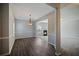 Dining room with wood floors, large window, stylish light fixture, and fireplace view at 3223 Tallon Sw Ln, Atlanta, GA 30311