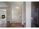Inviting entryway features hardwood floors, fresh paint, and staircase to the upper level at 3223 Tallon Sw Ln, Atlanta, GA 30311
