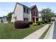 Attractive home with brick and vinyl exterior, green lawn, and well-manicured shrubbery at 3223 Tallon Sw Ln, Atlanta, GA 30311
