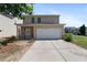 Exterior of home with a driveway, attached garage and flowerbeds at 3223 Tallon Sw Ln, Atlanta, GA 30311