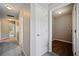 Hallway view showcasing white doors, carpet flooring, and recessed lighting at 3223 Tallon Sw Ln, Atlanta, GA 30311