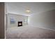 Spacious living room with fireplace, neutral carpeting, and abundant natural light at 3223 Tallon Sw Ln, Atlanta, GA 30311