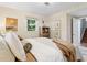Bright bedroom with woven wall decor, window views, and wooden furnishings at 3362 Northbrook Dr, Atlanta, GA 30340