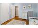 Bedroom with neutral color scheme, light blue walls and hardwood floors at 3362 Northbrook Dr, Atlanta, GA 30340