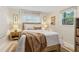 Cozy bedroom with a queen bed, wood accents, and sunny window at 3362 Northbrook Dr, Atlanta, GA 30340