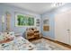 Bright bedroom with light blue walls, hardwood floors, and natural light at 3362 Northbrook Dr, Atlanta, GA 30340