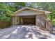 Spacious brick carport with ample room for parking and storage, and a large concrete driveway at 3362 Northbrook Dr, Atlanta, GA 30340