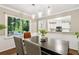 Dining room features a view into the kitchen and access to the outdoor space at 3362 Northbrook Dr, Atlanta, GA 30340