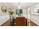 A warm, inviting dining room features hardwood floors and a window providing great natural light at 3362 Northbrook Dr, Atlanta, GA 30340