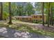 Charming brick home with a well-manicured front yard surrounded by mature trees at 3362 Northbrook Dr, Atlanta, GA 30340