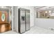 Open concept kitchen with stainless steel refrigerator, and modern fixtures at 3362 Northbrook Dr, Atlanta, GA 30340