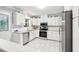 Bright kitchen featuring white cabinets, granite countertops, and stainless steel appliances at 3362 Northbrook Dr, Atlanta, GA 30340