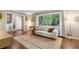 Bright living room featuring hardwood floors, large window, and stylish decor at 3362 Northbrook Dr, Atlanta, GA 30340