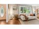Bright living room featuring hardwood floors, large window, and stylish decor at 3362 Northbrook Dr, Atlanta, GA 30340
