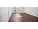 Bedroom with wood floors, a large window, and neutral paint, creating a serene retreat at 5555 Mountain Springs Cir, Stone Mountain, GA 30088