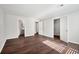 A bedroom with wood floors, access to an ensuite bathroom, and a walk-in closet at 5555 Mountain Springs Cir, Stone Mountain, GA 30088