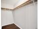 Spacious closet featuring custom wood shelving for optimal organization and storage at 5555 Mountain Springs Cir, Stone Mountain, GA 30088