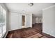 Living room with wood floors, gray walls, and a sliding glass door leading to the backyard at 5555 Mountain Springs Cir, Stone Mountain, GA 30088