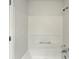 Bathroom featuring a bathtub and shower at 219 Cobblestone Trl, Avondale Estates, GA 30002