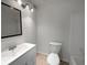 Bathroom featuring a single vanity, a toilet, and a bathtub at 219 Cobblestone Trl, Avondale Estates, GA 30002