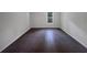 Neutral bedroom featuring ceramic floors and a window for natural light at 219 Cobblestone Trl, Avondale Estates, GA 30002