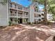 Inviting condo building with well-maintained landscaping and classic architecture at 219 Cobblestone Trl, Avondale Estates, GA 30002