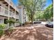 Multi-story condo building with inviting balconies, landscaped grounds, and convenient parking at 219 Cobblestone Trl, Avondale Estates, GA 30002