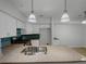 Bright kitchen showcasing granite countertops, modern pendant lighting, and stainless steel appliances at 219 Cobblestone Trl, Avondale Estates, GA 30002