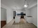Bright kitchen with modern appliances, breakfast bar and tiled floors at 219 Cobblestone Trl, Avondale Estates, GA 30002