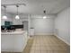 Well-lit kitchen featuring an island, stainless steel appliances, and ceramic flooring at 219 Cobblestone Trl, Avondale Estates, GA 30002