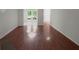 Bright open-concept living room showcasing gorgeous hardwood floors and natural light at 219 Cobblestone Trl, Avondale Estates, GA 30002