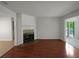 Spacious living room featuring a fireplace and gleaming hardwood floors at 219 Cobblestone Trl, Avondale Estates, GA 30002