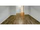 Room features hardwood flooring and a view into the bathroom at 219 Cobblestone Trl, Avondale Estates, GA 30002