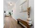 Inviting entryway featuring hardwood floors, a decorative mirror, and a stylish bench at 3610 Silvery Way, Powder Springs, GA 30127