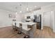 Bright kitchen with an island, modern stainless appliances, and barstool seating at 3610 Silvery Way, Powder Springs, GA 30127