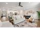 Spacious open-concept living room with modern furnishings, seamlessly connected to the kitchen and dining area at 3610 Silvery Way, Powder Springs, GA 30127