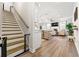 Inviting living space flows from the staircase, showcasing an open floor plan with modern finishes and ample natural light at 3610 Silvery Way, Powder Springs, GA 30127