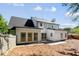An expansive backyard with pine straw, a white exterior, and a fenced perimeter at 4168 Arapaho Dr, Powder Springs, GA 30127