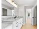 Bathroom showcasing granite counters, black hardware and bright lighting at 4168 Arapaho Dr, Powder Springs, GA 30127