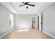 Neutral primary bedroom with ceiling fan, and access to the primary bathroom at 4168 Arapaho Dr, Powder Springs, GA 30127