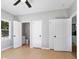 Spacious bedroom boasts light-colored wood floors and access to ensuite bathroom at 4168 Arapaho Dr, Powder Springs, GA 30127