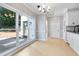 Bright breakfast nook with large windows and stylish chandelier lighting at 4168 Arapaho Dr, Powder Springs, GA 30127